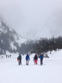 Snow sports over a frozen lake in Estes Park. We had an amazing time hiking with the snow falling down.
